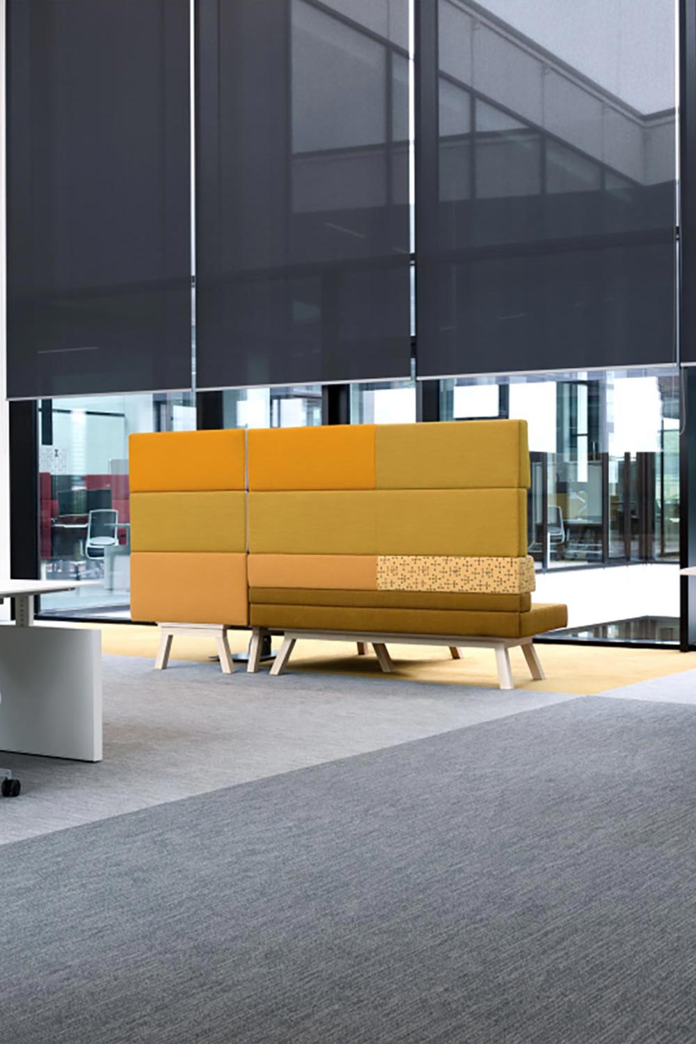 Modern office space with colorful acoustic privacy seating and large windows