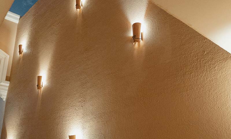 Artistic decorative wall-mounted lighting fixture