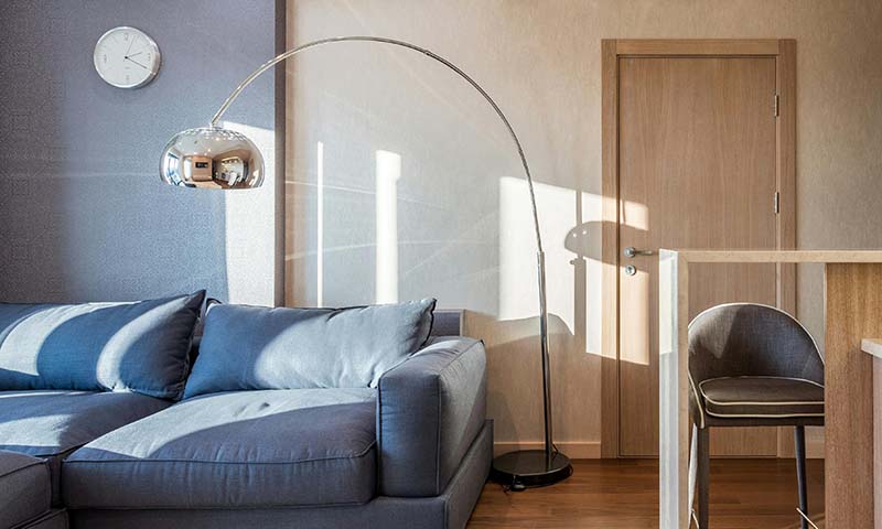 Adjustable reading lamp with a focused light beam