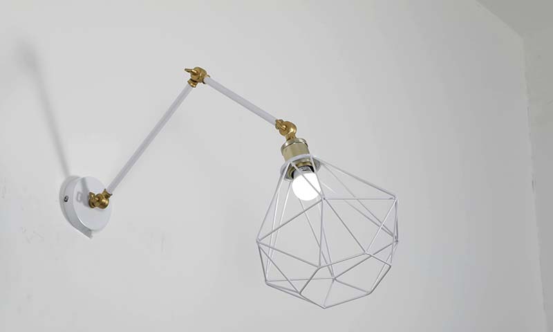 Adjustable swing-arm wall lamp for reading