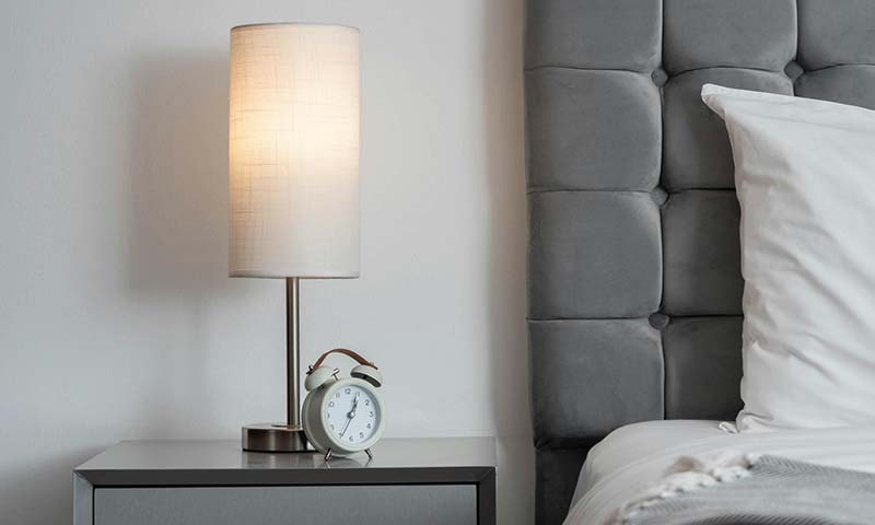Stylish table lamp on a side table providing a warm glow
