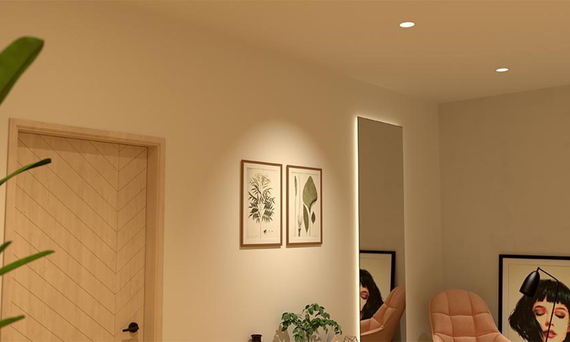 Interior wall with two botanical prints and a tall mirror illuminated by warm recessed lights